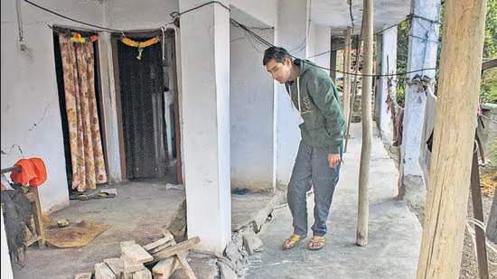 A-man-inspects-the-damages-at-his-residence-in-Jos_1673636035868 (1)